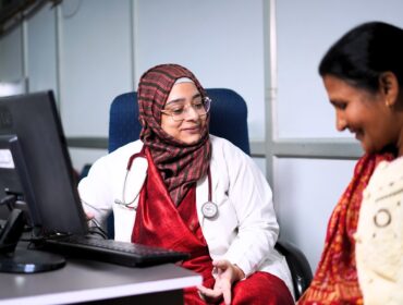 An Indian lady doctor talking to a patient