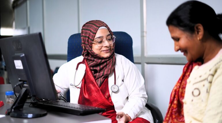 An Indian lady doctor talking to a patient